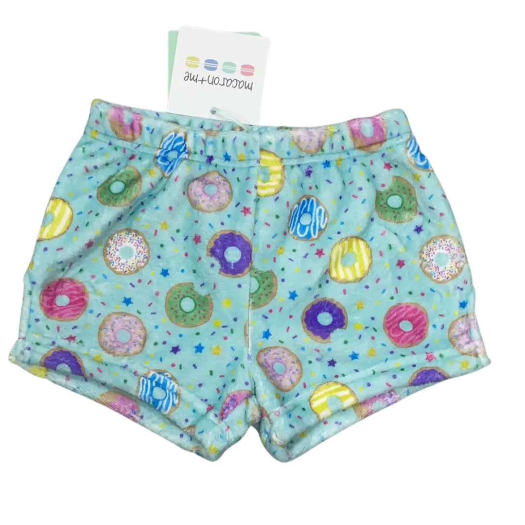 Children's shorts with colorful donut pattern on a white background